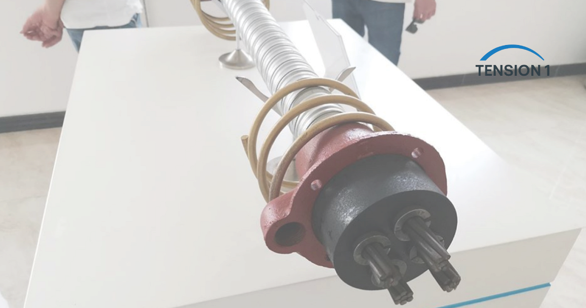 Multistrand post-tensioning anchorage with wedges, bursting spiral and duct on display, the hardware loaded during post tension slab stressing