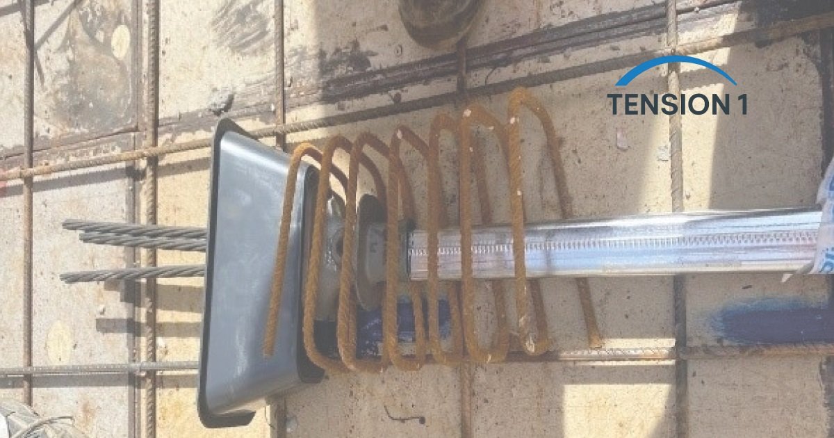 Multistrand post-tensioning anchorage with trumpet and bursting spiral set in the reinforcement before the pour of a post tension slab
