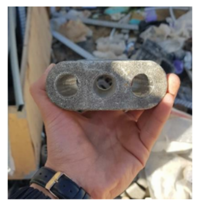 Flat multistrand anchorage bearing plate with three strand openings for a post tension slab